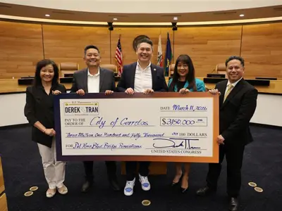 Check presentation in the City Council Chamber. From left: Councilmember Jennifer Hong, Mayor Frank Aurelio Yokoyama, Congressmen Derek Tran, Mayor Pro Tem Lynda P. Johnson, and Councilmember Mark E. Pulido. 